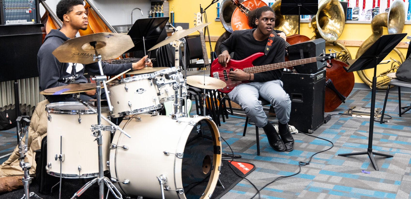 Two students rehearsing music at Creative Arts High School