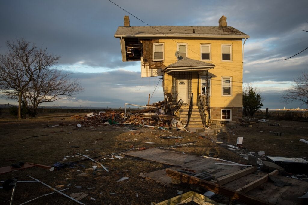 A home after a devastating storm broke half of it