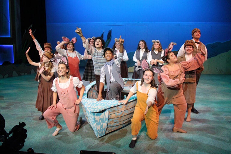 Performers on stage during a play